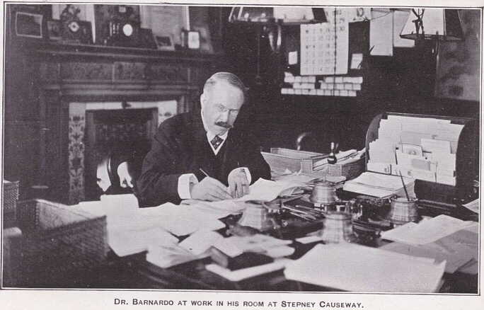 Photograph of Dr. Barnardo working at his desk